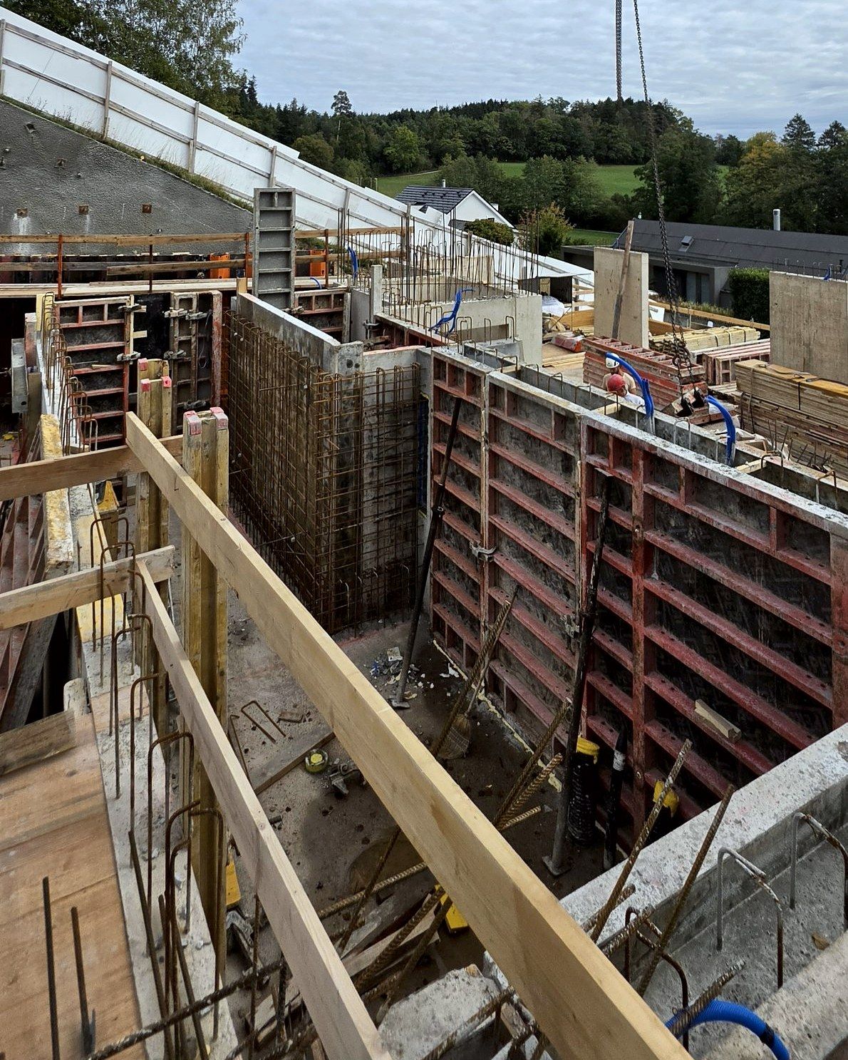 Wall formwork and rebar cage, crane hook above